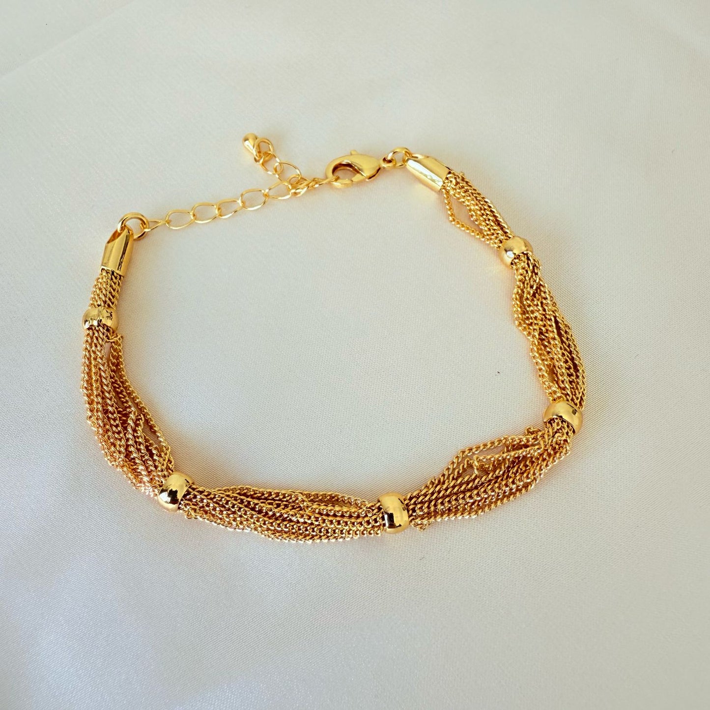 Bracelet - Simple gold chains with each other