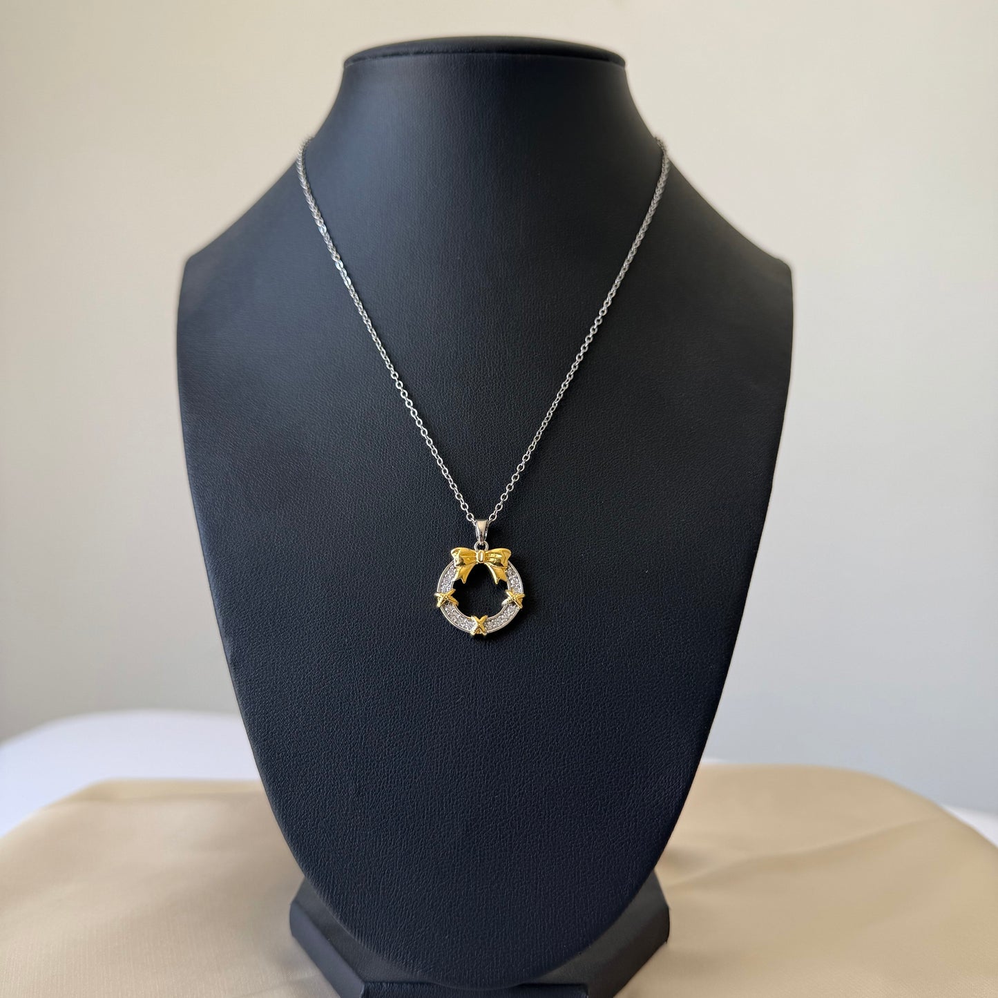 Stainless Steel- Gold necklace bow in zircon circle