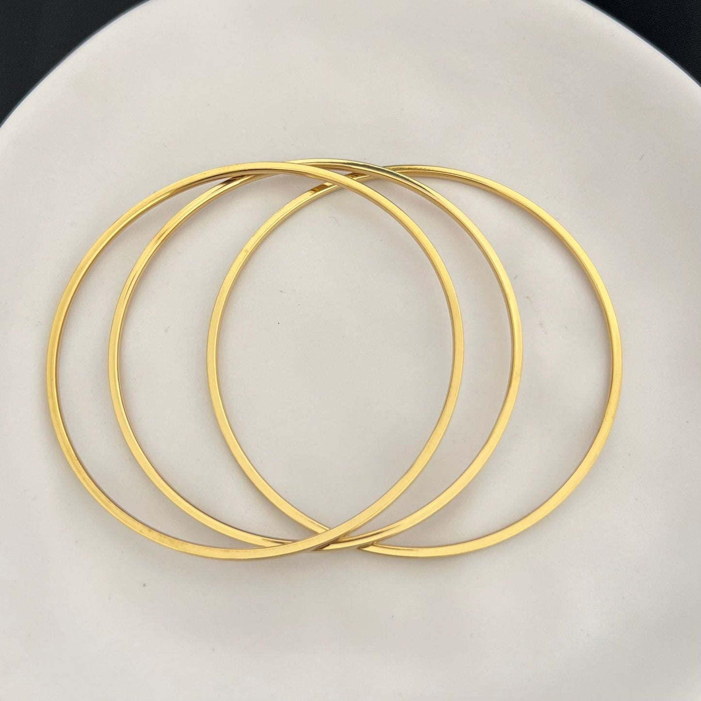 Stainless steel- 3 thin gold bangles two sizes